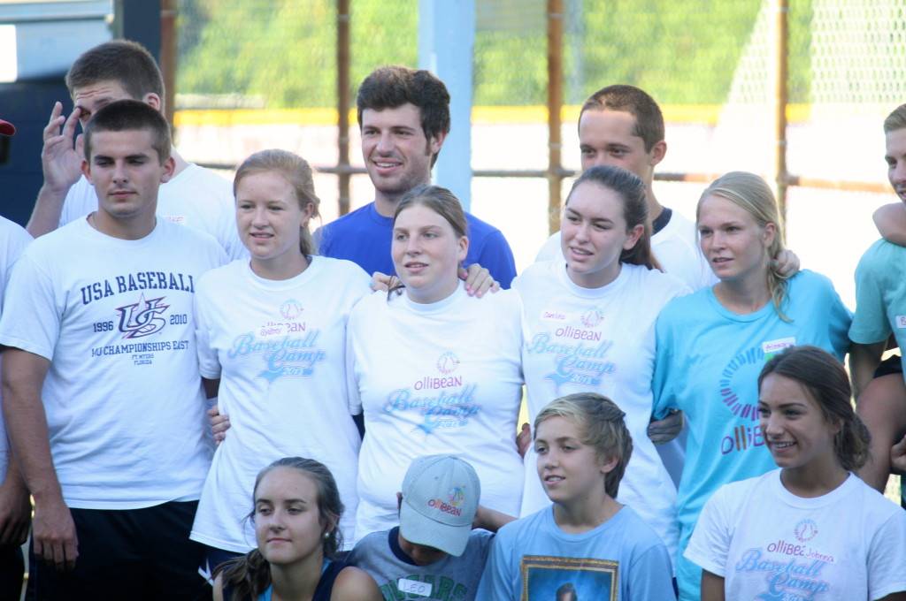 Photograph of young men and women smiling for the camera