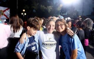 Photograph of three teenagers at the Obama rally.
