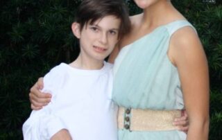 Photograph of a boy and girl looking at the camera.