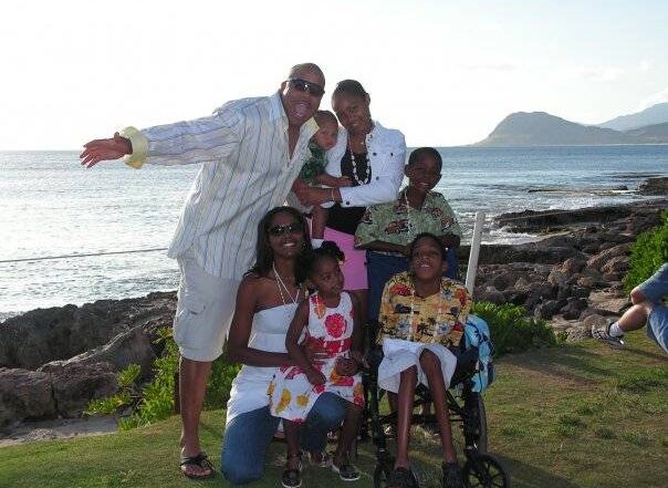 Photograph of family of 5 on the beach