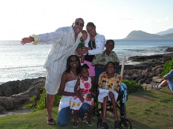 Photograph of family of 5 on the beach