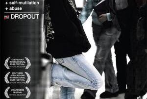 Image description: Who Cares About Kelsey DVD Cover. Photograph of light skinned girl with brown hair wearing a black sweatshirt and jeans, leaning up against a locker, turned to the side face looking to her right. Students in the hall in the background. Text reads Failing grades + ADHD + Self mutilation + Abuse white equal sign with red slash indicating “not equal”. Dropout. Festival Awards listed on left side of screen. "Who Cares About Kelsey? a documentary by Dan Habib. Education Kit.