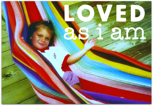 Image of young girl in multicolored hammock. She is smiling contently. "Loved As I Am" is in white text with small Ollibean logo.