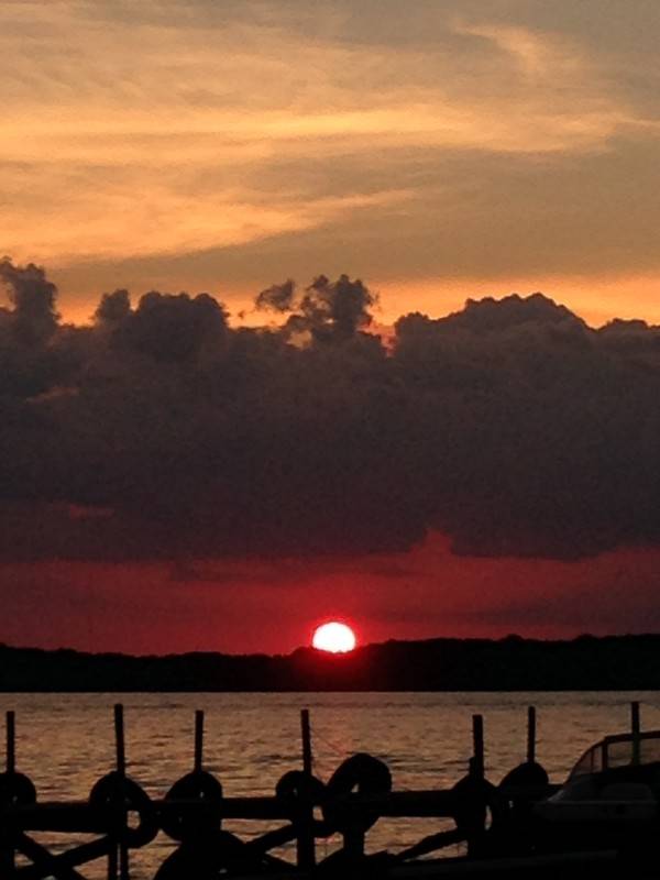 Photograph of sky and lake at sunset.