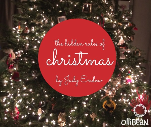 Photo of Christmas tree. Red Circle in middle with " The Hidden Rules of Christmas by Judy Endow on Ollibean "