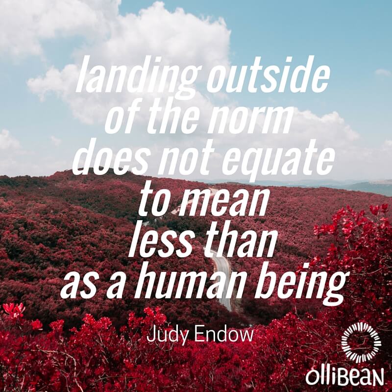 Photograph of sky and red bougainvillea . Text reads "Landing outside of the norm does not equate to mean less than as a human being. Judy Endow on Ollibean"