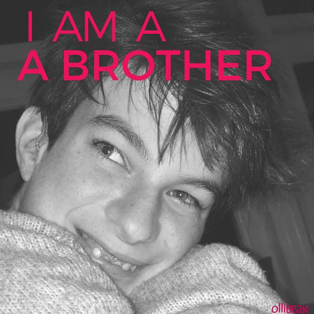 teenager smiling "I am a brother."